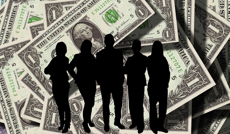 people on shadow with dollar bills on the background